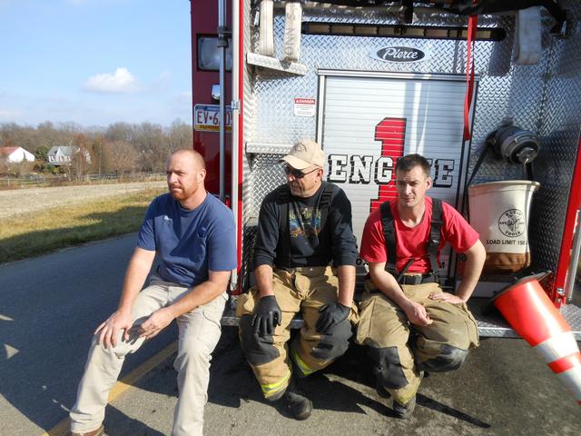 Firefighters Dave Messaros, Mike Nelson, and Win Slauch taking a break at an incident.